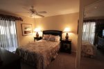 Main suite offers a queen bed and patio access
